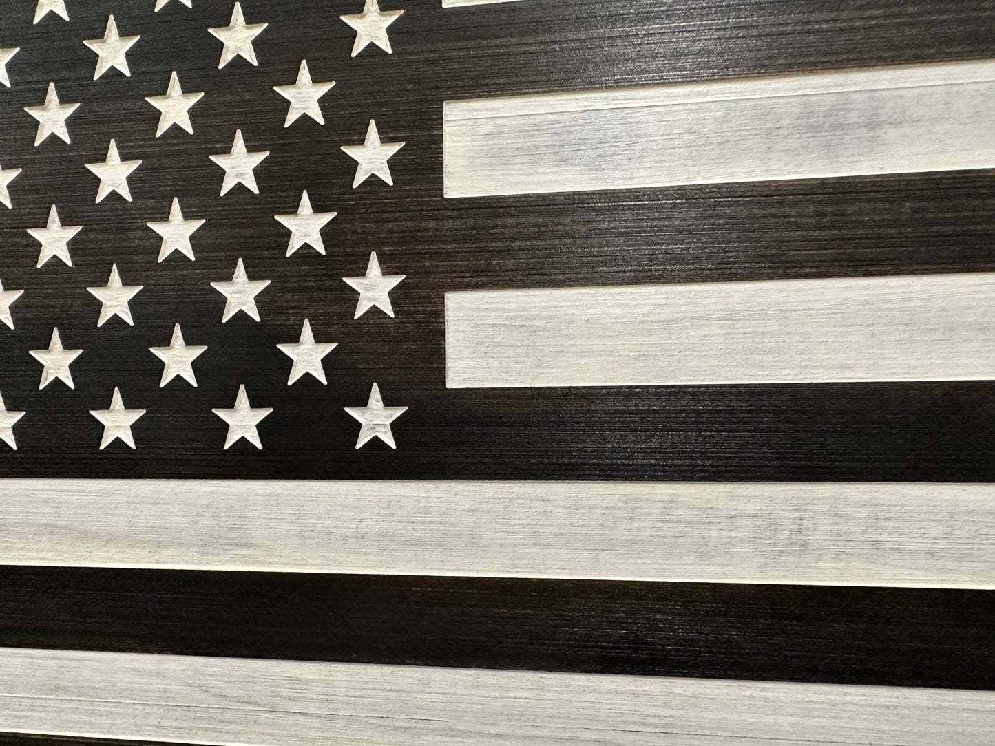 Wooden American flag with dark and light stripes
