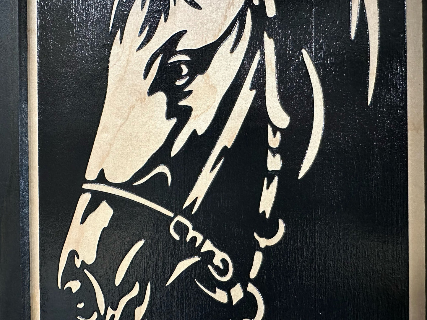 Stylized illustration of a horse's head on a black background