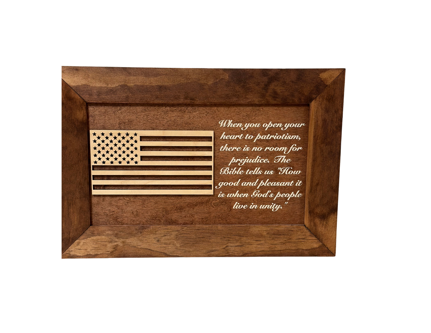 Wooden plaque with American flag design and engraved text on a white background