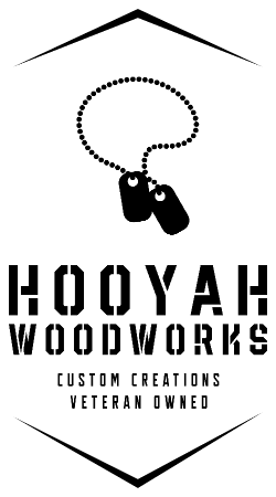 Logo of Hooyah Woodworks with dog tags and text on a white background