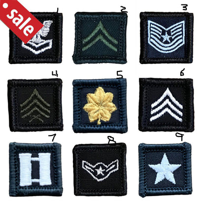 Collection of military rank insignias on a white background with a sale label.