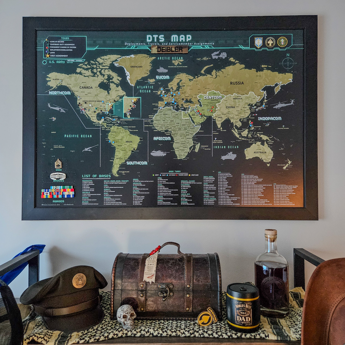 World map poster on a wall with decorative items below
