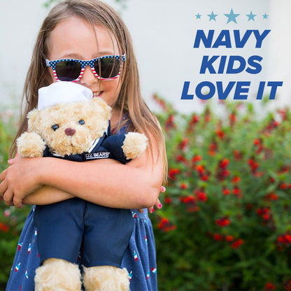 Child wearing sunglasses and holding a teddy bear with 'NAVY KIDS LOVE IT' text.