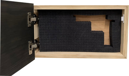 Wooden box with black foam inserts on a white background