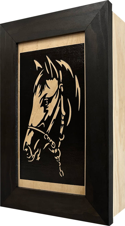 Framed artwork of a horse's head on a black background