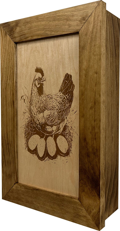 Wooden box with a engraved design of a rooster on a white background