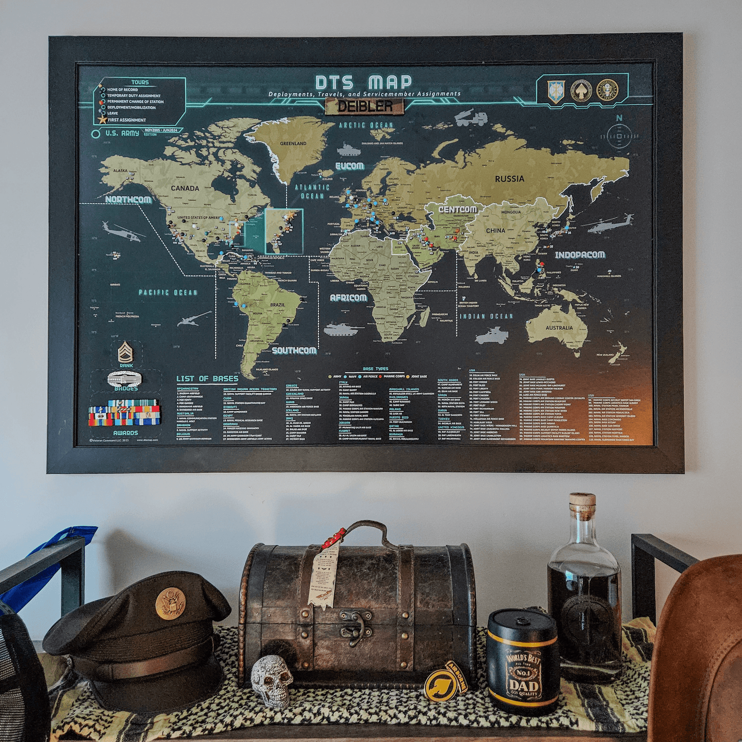 World map poster on a wall with decorative items below