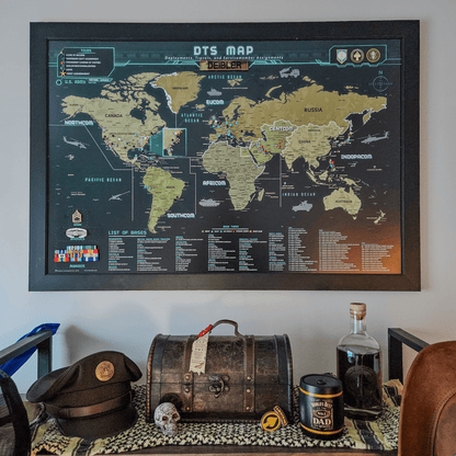 World map poster on a wall with decorative items below
