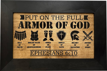 Wooden plaque with armor of God symbols and text on a black background