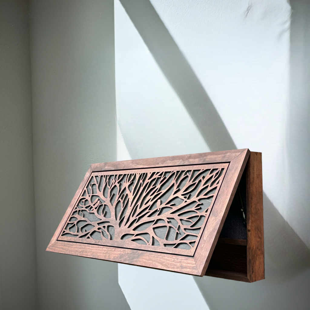 Wooden decorative panel with intricate cut-out design on a plain background