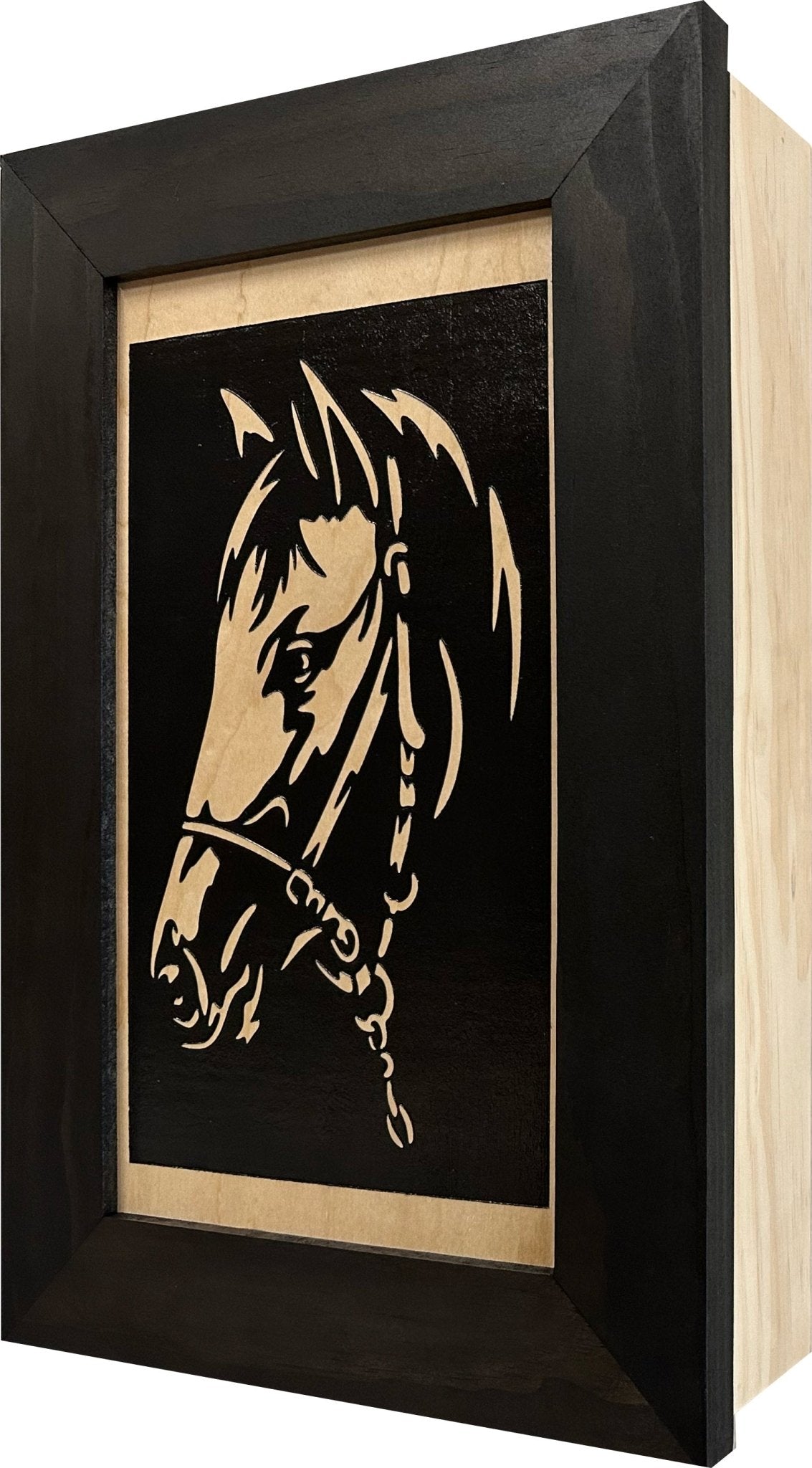 Framed artwork of a horse's head on a black background