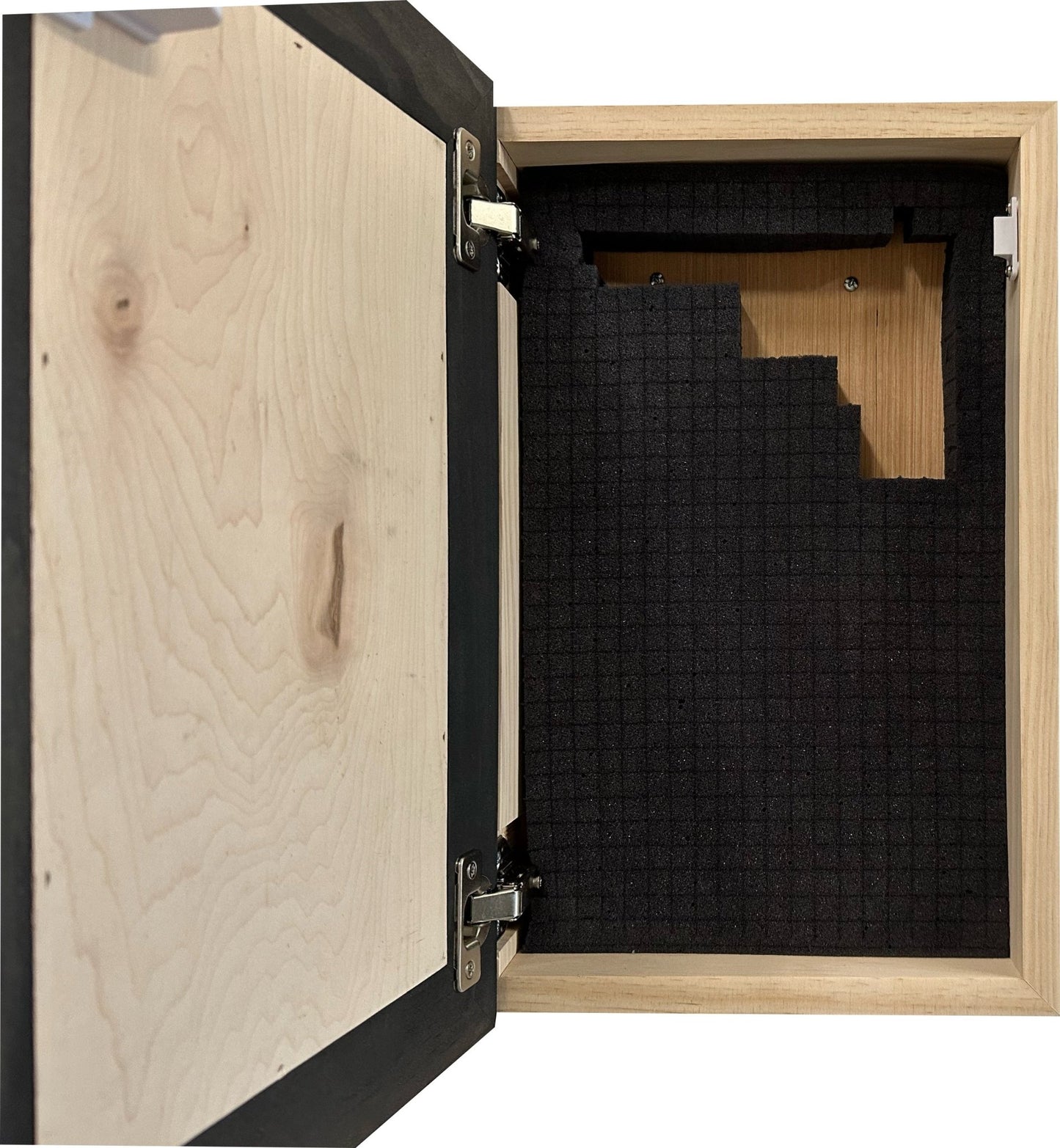 Wooden cabinet with one door open, revealing black soundproofing material inside.