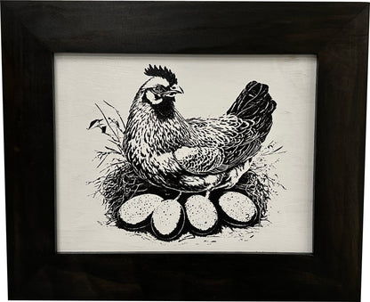Framed artwork of a chicken with eggs on a neutral background